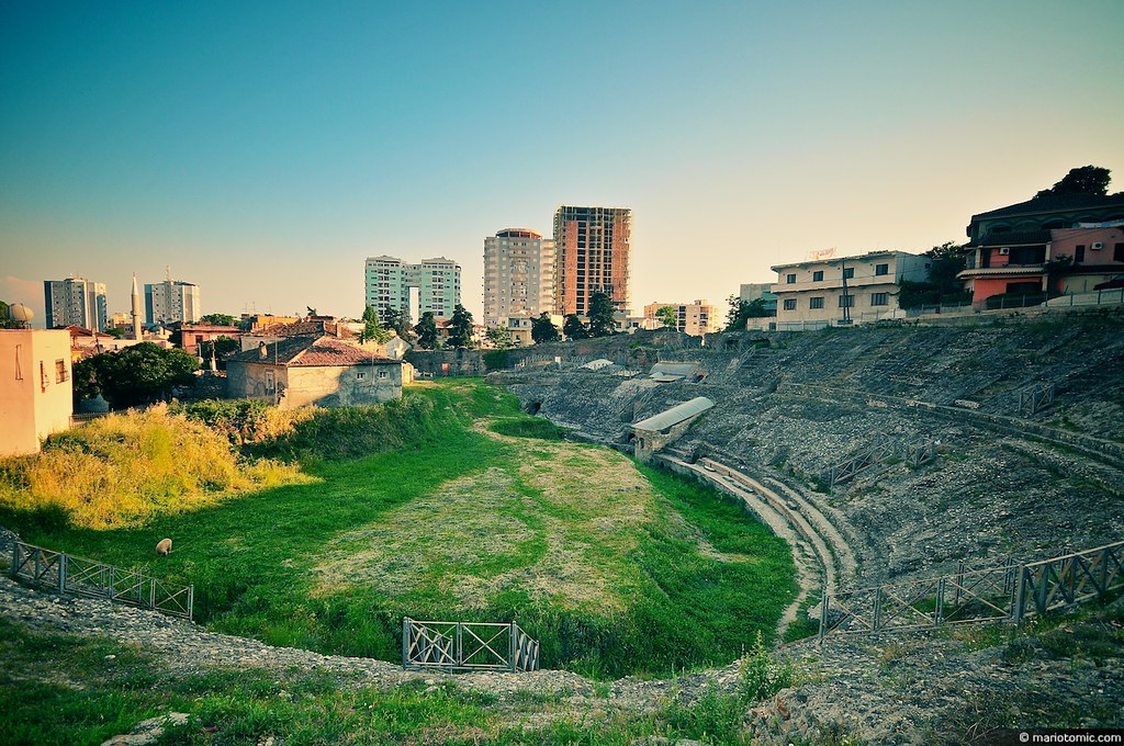 Aerial view of Durrës Amphitheater surrounded by modern buildings in Albania