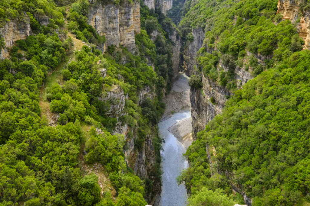 Tourists rafting through the narrow river passages of Osumi Canyon in southern Albania