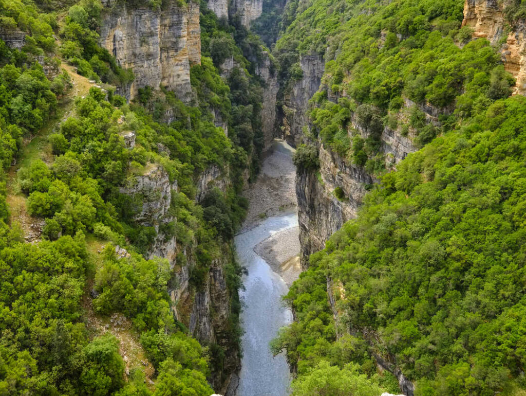 Rafting through the narrow river passages of Osumi Canyon in southern Albania