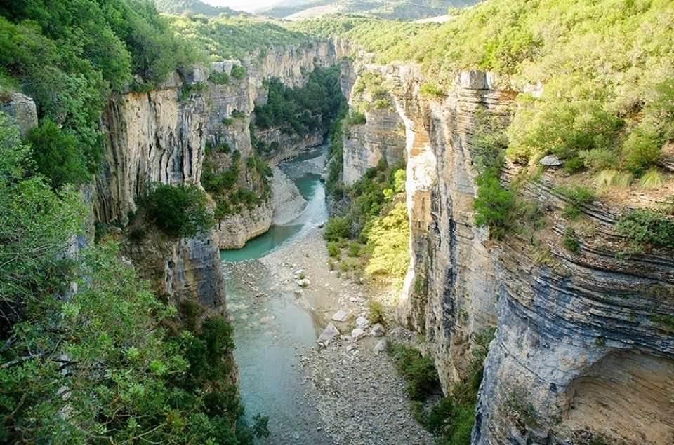 The towering limestone walls of Osumi Canyon glowing under the afternoon sun